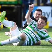 James McCarthy is felled by Jason Holt as Celtic slipped up at Livingston.