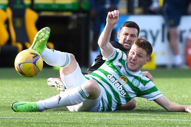 James McCarthy is felled by Jason Holt as Celtic slipped up at Livingston.