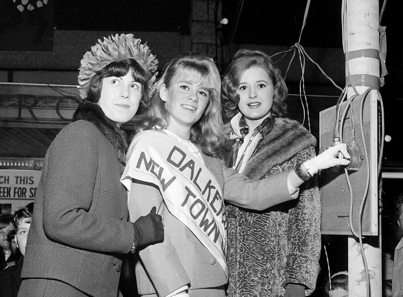 Dalkeith's New Town Girl, 18 year-old Joan Hepburn, switches on the Town Christmas Lights in 1964 watched by runners-up Ruth Wysick and Teresa O'Brien.