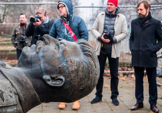 Off with his head? A statue of Joseph Stalin is lifted by a crane in Berlin, on its way to an exhibition about the former Soviet dictator called 'Stalin, The Red God' (Picture: John MacDougall/AFP via Getty Images)