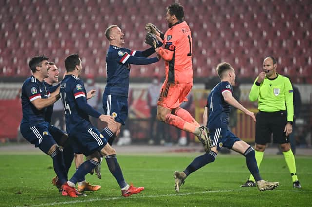 Scotland's players celebrate after winning the Euro 2020 play-off qualification match against Serbia.
