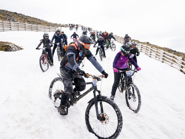 Following an arduous climb up the mountain, which reaches 1,221 metres, riders started in deep snow at the beginning of the route.