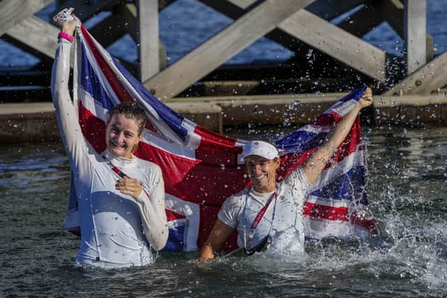 Great Britain's Eilidh Mcintyre, left, and Hannah Mills celebrate after winning the 470 women's gold medal. Picture: Bernat Armangue/AP