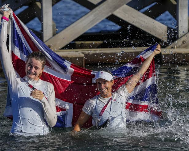 Great Britain's Eilidh Mcintyre, left, and Hannah Mills celebrate after winning the 470 women's gold medal. Picture: Bernat Armangue/AP