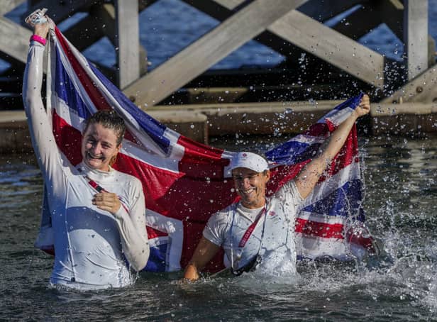 Great Britain's Eilidh Mcintyre, left, and Hannah Mills celebrate after winning the 470 women's gold medal. Picture: Bernat Armangue/AP