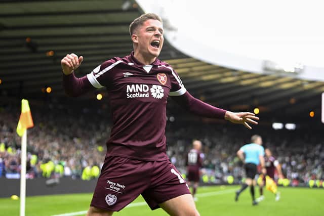 Cammy Devlin leads the Hearts celebration after beating Hibs at Hampden.