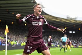 Cammy Devlin leads the Hearts celebration after beating Hibs at Hampden.