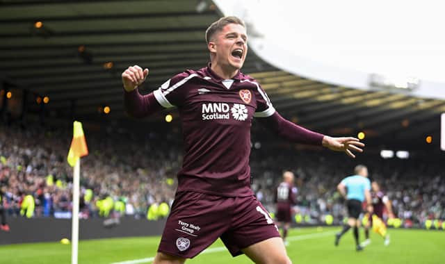 Cammy Devlin leads the Hearts celebration after beating Hibs at Hampden.