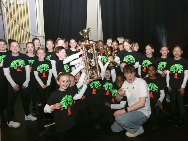 Calum presenting Winners trophy to Bellsquarry PS, Livingston