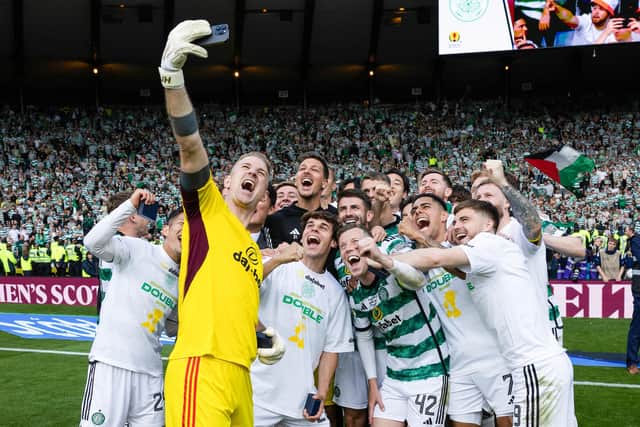 Celtic's Joe Hart takes a picture of the squad.