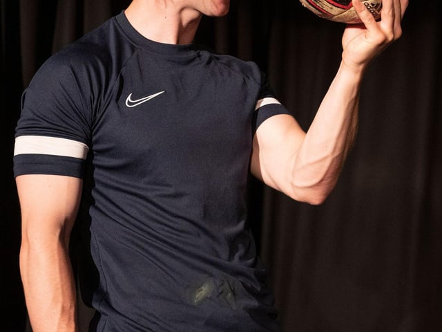 Alfie Cain performing his one-man play Dropped on stage