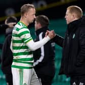Leigh Griffiths (L) shakes the hand of manager Neil Lennon after being substituted during Celtic's 2-0 win over Ross County. The striker scored his side's second goal. (Photo by Craig Williamson / SNS Group)