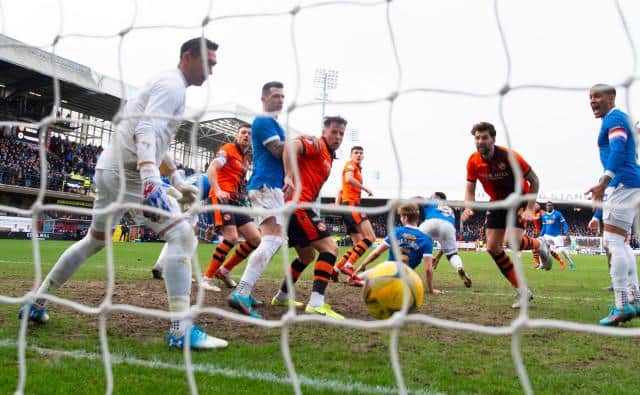 Dundee United's Ross Graham scores to make it 1-0 during a Cinch Premiership match between Dundee United and Rangers at Tannadice Park, on February 20, 2022, in Dundee, Scotland.  (Photo by Alan Harvey / SNS Group)