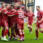 Aberdeen's players celebrate after Duk put them ahead after just 20 seconds against Kilmarnock.