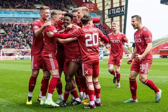 Aberdeen's players celebrate after Duk put them ahead after just 20 seconds against Kilmarnock.