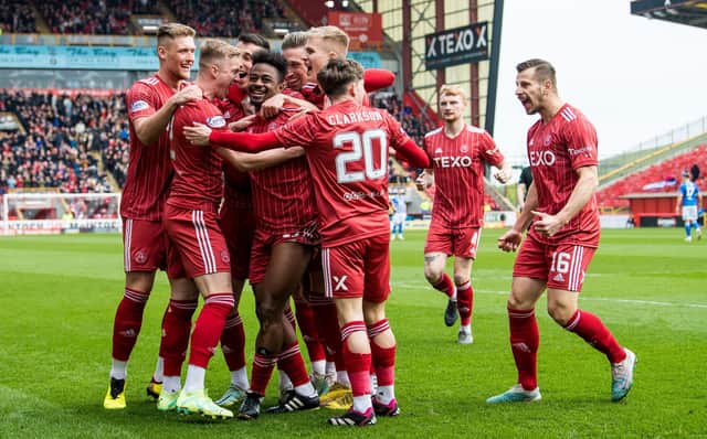 Aberdeen's players celebrate after Duk put them ahead after just 20 seconds against Kilmarnock.