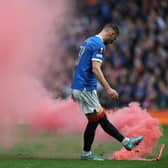 GLASGOW, SCOTLAND - MAY 05: Borna Barisic of Rangers clears a flare from the pitch during the UEFA Europa League Semi Final Leg Two match between Rangers and RB Leipzig at Ibrox Stadium on May 05, 2022 in Glasgow, Scotland. (Photo by Ian MacNicol/Getty Images)