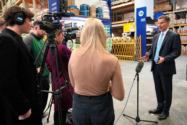 Chancellor Jeremy Hunt paid a visit to a builders warehouse in London yesterday (Picture: Kirsty Wigglesworth/pool/AFP via Getty Images)