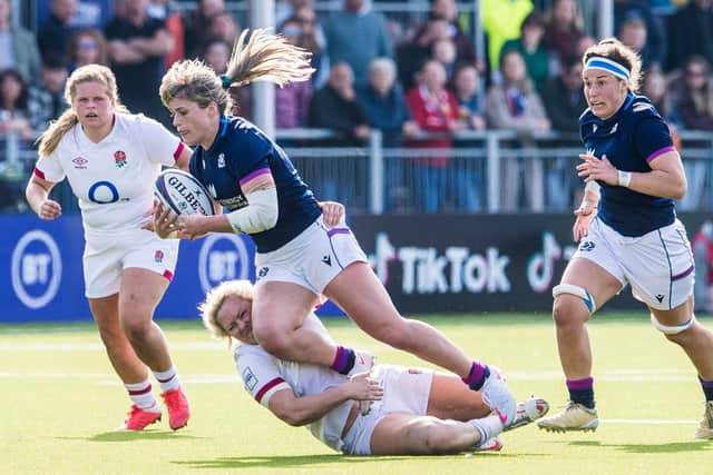 Scotland's Hannah Smith is tackled by England's Amber Reed during the TikTok Women's Six Nations opener at the DAM Health Stadium.  (Photo by Ross Parker / SNS Group)