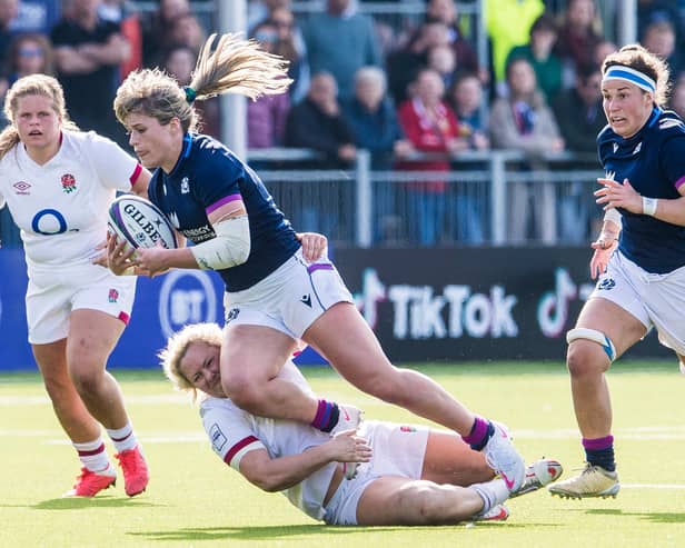 Scotland's Hannah Smith is tackled by England's Amber Reed during the TikTok Women's Six Nations opener at the DAM Health Stadium.  (Photo by Ross Parker / SNS Group)