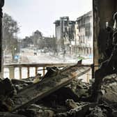 A Russian soldier in the ruins of the Mariupol drama theatre, bombed in March last year despite a large sign saying children were sheltering there (Picture: Alexander Nemenov/AFP via Getty Images)