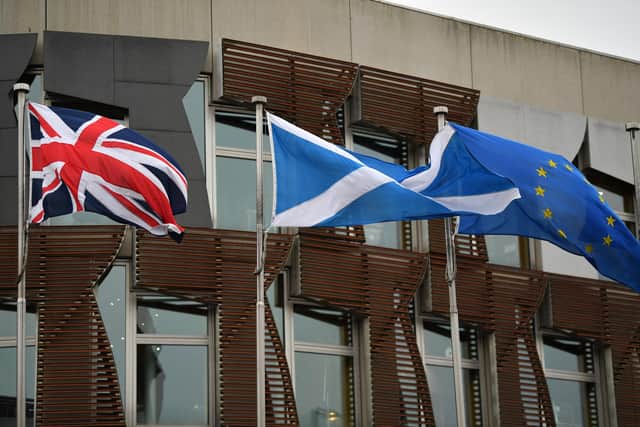The Scottish Saltire flies alongside the Union Jack and the European Union flags. Picture: Jeff J Mitchell/Getty Images