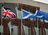 The Scottish Saltire flies alongside the Union Jack and the European Union flags. Picture: Jeff J Mitchell/Getty Images