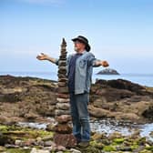 Enthusiasts take part in the European Stone Stacking Championships on July 10, 2021, in Dunbar, Scotland. The championships now in its fifth year, is Europe's largest championships for all Stone Stacking and Rock Balancing enthusiasts and artists. (Photo by Jeff J Mitchell/Getty Images)