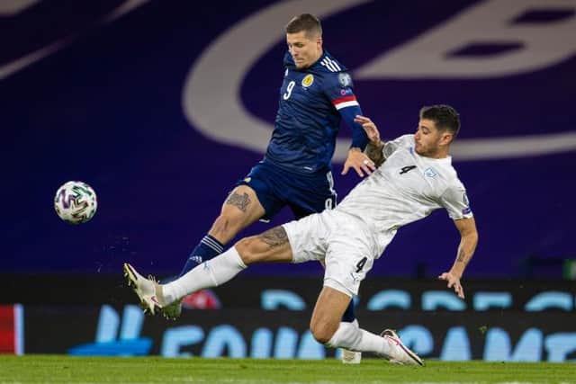 Scotland's Lyndon Dykes (left) competes with Israel's Nir Bitton during a Euro 2020 Play off match between Scotland and Israel at Hampden Park, on October 08 2020, in Glasgow, Scotland (Photo by Craig Williamson / SNS Group)