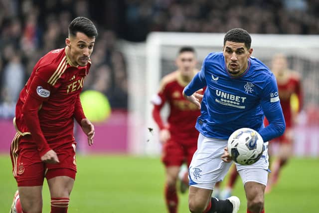 Aberdeen's Bojan Miovski (L) and Rangers' Leon Balogun are likely to come up against each other today.