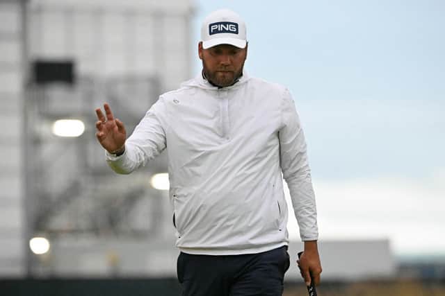 England's Daniel Brown reacts to making a birdie putt on the 16th green at Royal Troon. Picture: Andy Buchanan/AFP via Getty Images.