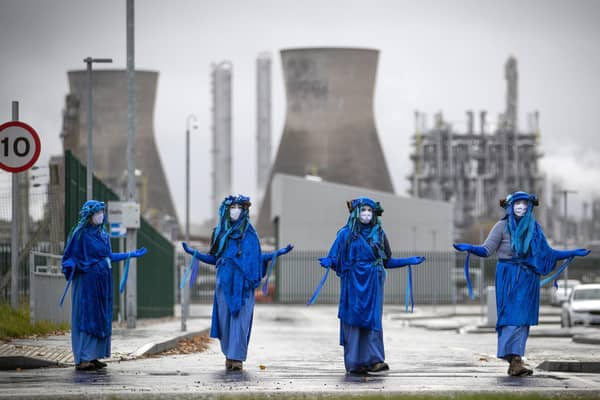 Extinction Rebellion Scotland campaigners blockade the road and demonstrate outside the Ineos oil refinery at Grangemouth.