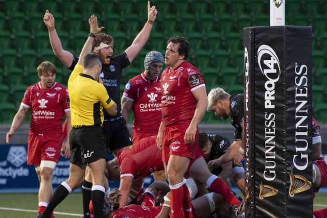 Glasgow's Rob Harley (L) celebrates Ryan Wilson's try against Scarlets. Picture: Ross Parker / SNS