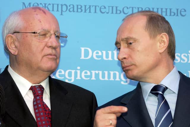 File photo taken on December 21, 2004 Russian President Vladimir Putin (R) talks to former Soviet President Mikhail Gorbachev (L) prior to a joint press conference of German Chancellor Gerhard Schroeder and Putin at Gottorf castle in Schleswig. Russian President Vladimir Putin said on August 31, 2022 that Mikhail Gorbachev, made a 'huge impact' on world history. (Photo by Alexander NEMENOV / AFP) (Photo by ALEXANDER NEMENOV/AFP via Getty Images)