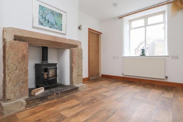 With a feature fireplace, the living room looks like it would be a cosy space.