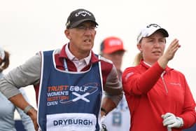 Gemma Dryburgh sizes up a shot with caddie Paul Heselden in the first round of the Trust Golf Women's Scottish Open at Dundonald Links.