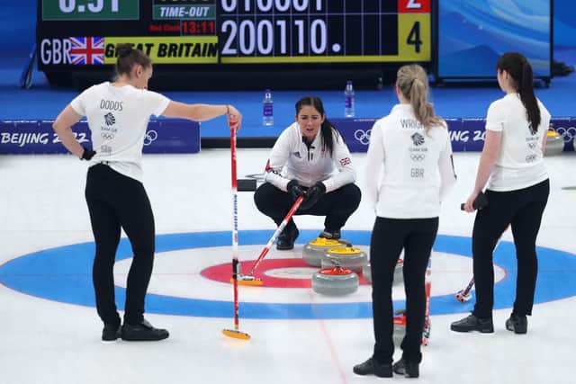 From left, Jennifer Dodds, Eve Muirhead, Vicky Wright and Hailey Duff of Team Great Britain talk through a shot during the final.