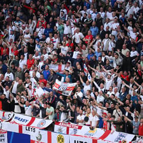 England fans sing their national anthem prior to kick-off ahead of the Euro 2024 group stage match against Serbia at Arena AufSchalke in Gelsenkirchen, Germany.   (Photo by Matthias Hangst/Getty Images)