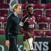 Beni Baningime smiles alongside Hearts manager Robbie Neilson after a man of the match debut in the 2-1 win over Celtic on July 31 (Photo by Ross Parker / SNS Group)