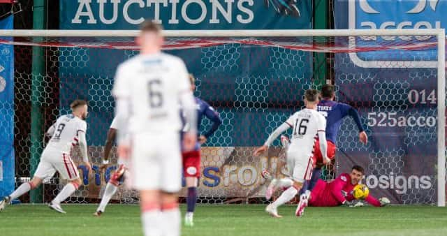 Hamilton's Andy Ryan (L) has his penalty saved by Kilmarnock goalkeeper Zach Hemming during a Cinch Championship match between Hamilton and Kilmarnock at the Fountain of Youth Stadium, on December 26, 2021, in Hamilton, Scotland (Photo by Sammy Turner / SNS Group)