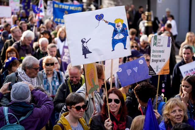 Demonstrators hold placards as they take part in a march by the People's Vote organisation in central London on October 19, 2019, calling for a final say in a second referendum on Brexit. - Thousands of people march to parliament calling for a "People's Vote", with an option to reverse Brexit as MPs hold a debate on Prime Minister Boris Johnson's Brexit deal. (Photo by Niklas HALLE'N / AFP) (Photo by NIKLAS HALLE'N/AFP via Getty Images)