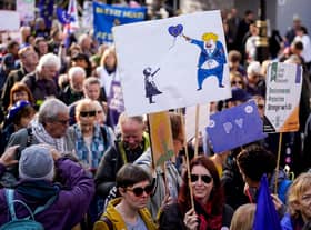 Demonstrators hold placards as they take part in a march by the People's Vote organisation in central London on October 19, 2019, calling for a final say in a second referendum on Brexit. - Thousands of people march to parliament calling for a "People's Vote", with an option to reverse Brexit as MPs hold a debate on Prime Minister Boris Johnson's Brexit deal. (Photo by Niklas HALLE'N / AFP) (Photo by NIKLAS HALLE'N/AFP via Getty Images)
