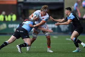 Edinburgh man of the match Jamie Ritchie is tackled by Ciaran Parker of Cardiff. Pic: Kian Abdullah/Huw Evans/Shutterstock (14452694y)