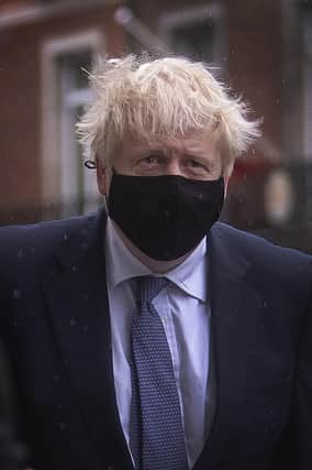 A masked Boris Johnson said people should cut down on eating cheeseburgers.