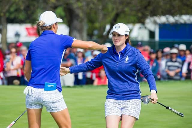 Leona Maguire, right, celebrates with Mel Reid after their brilliant win over the Korda sisters - Nelly and Jessica - in the opening session of the 17th Solheim Cup in Toledo, Ohio. Picture: Tristan Jones.