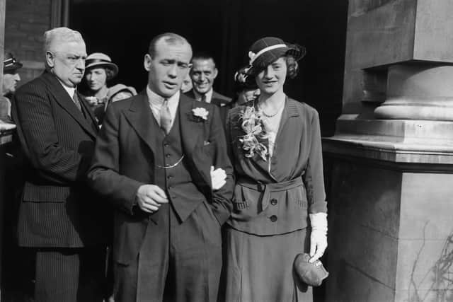 Scotland and Chelsea footballer Hughie Gallacher (1903 - 1957) with Hannah Anderson after their wedding at Hammersmith Registry Office, 29th September 1934. (Photo by J. A. Hampton/Topical Press Agency/Hulton Archive/Getty Images)