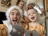 LadBaby, real name Mark Hoyle, celebrating with his wife Roxanne Hoyle and their children, after his song Don't Stop Me Eatin' topped the singles charts for Christmas, making it his third Christmas number one in a row.