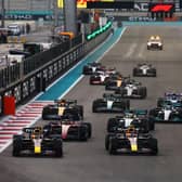 Max Verstappen and Sergio Perez leading the field into turn one at the start during the F1 Grand Prix of Abu Dhabi - the last race of the 2022 season.