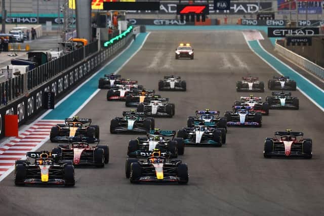 Max Verstappen and Sergio Perez leading the field into turn one at the start during the F1 Grand Prix of Abu Dhabi - the last race of the 2022 season.