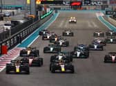 Max Verstappen and Sergio Perez leading the field into turn one at the start during the F1 Grand Prix of Abu Dhabi - the last race of the 2022 season.